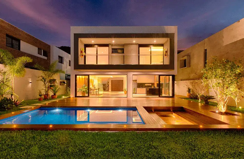 portas de vidro com visão o espaço de lazer com piscina e paisagismo