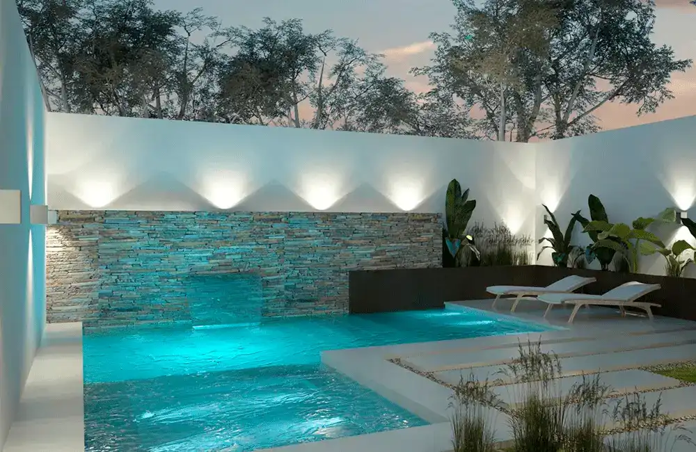 piscina de hidro com parede de pedras naturais e cascata saindo da parede 