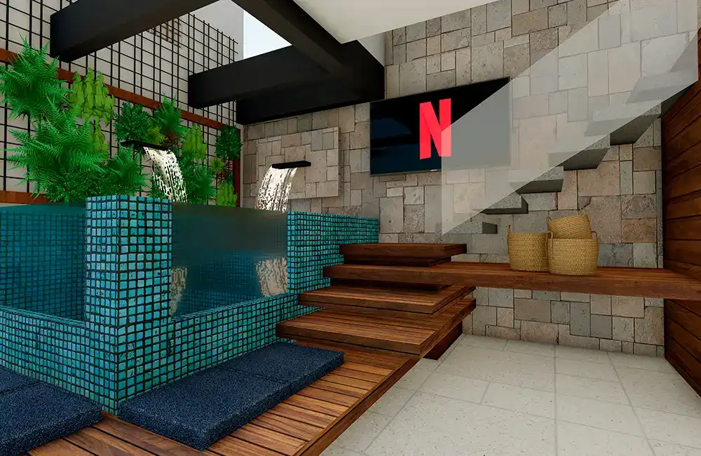 espaço pequeno interno com decks de madeira com pisicna de parede dupla de vidro e cascata com jardim vertical e parede de pedras 