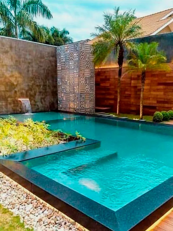 paisagismo piscina com revestimento de pedras naturais