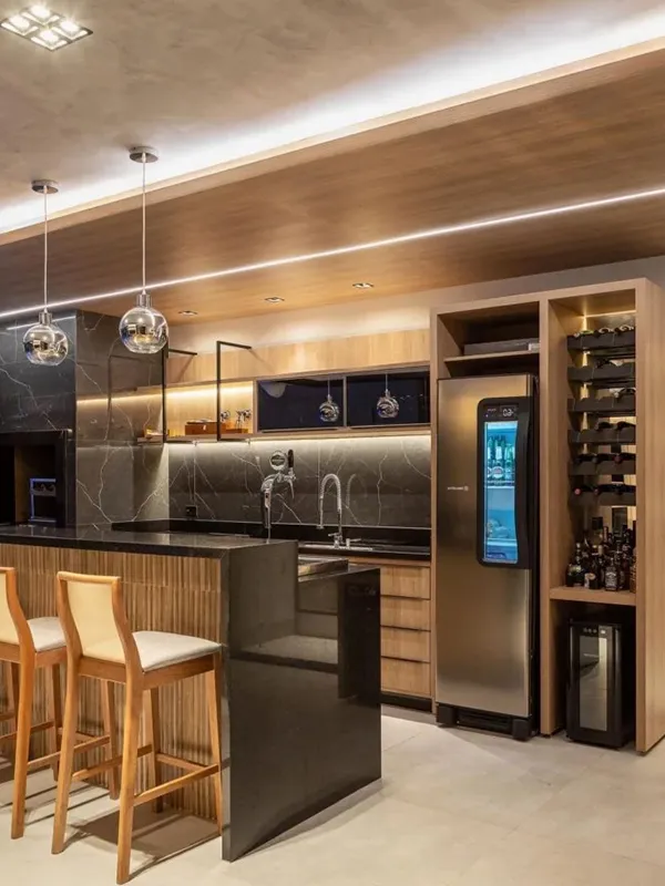 Descubra os 7 Modelos de Porcelanato para Área Gourmet: Elegância e Praticidade de Limpeza 95 churrasqueira e forno na área gourmet planejada com bancada de porcelanato