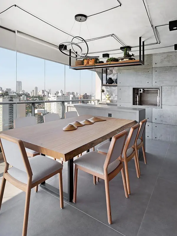 decoração na varanda gourmet com porcelanato fosco e churrasqueira branca