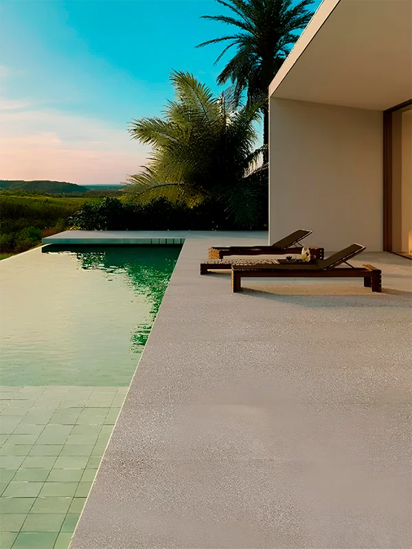 porcelanato cimenticio aplicado em volta de uma piscina com borda infinita