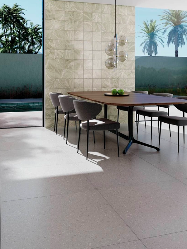 Uma moderna sala de jantar com mesa e cadeiras.