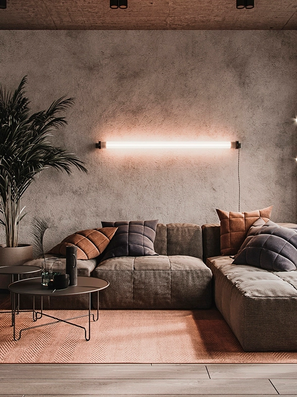 Uma sala de estar com sofá e luminária.