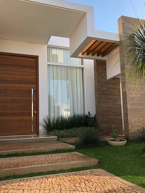 parede externa destacada com revestimento de pedras