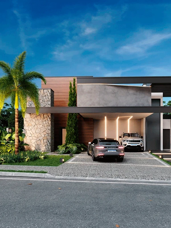 Casa moderna de dois andares com detalhes em pedra e madeira, com uma entrada com porcelanato para garagem, dois carros estacionados, jardim paisagístico e uma palmeira na frente.