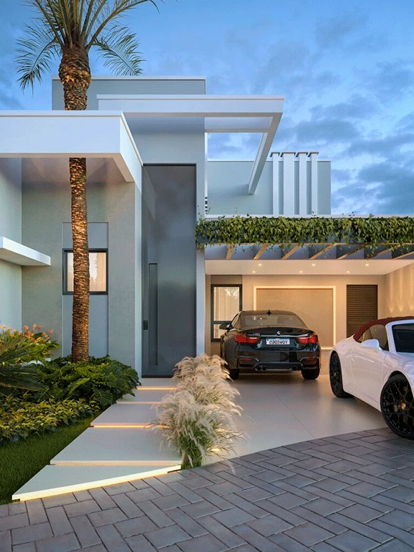 Casa moderna de dois andares com janelas grandes, uma palmeira alta, jardim paisagístico e dois carros estacionados na entrada da garagem com um elegante porcelanato para garagem ao anoitecer.